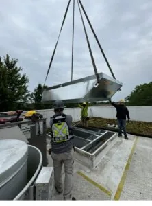 Verde employees working on the rooftop for a commercial energy efficiency project